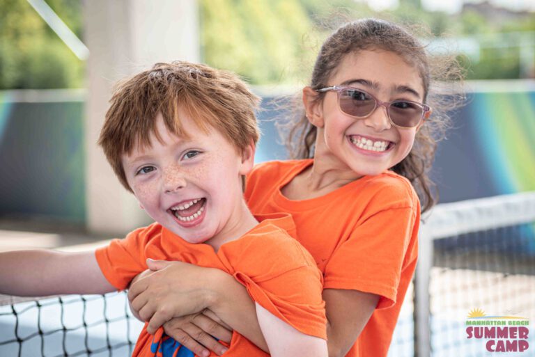 a couple of children from summer camp playing together