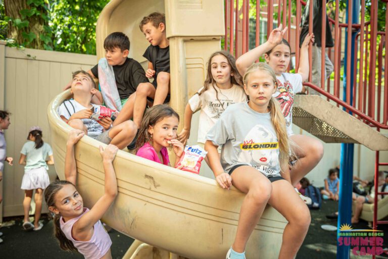 children playing on a summer camp playground