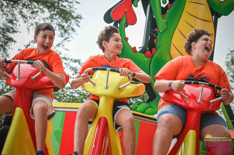 group of boys on an amusement park ride